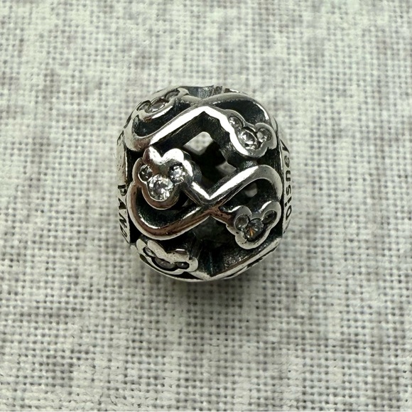 NWOB Disney x Pandora Sterling Silver Mickey Infinity Spacer Charm - Picture 1 of 4
